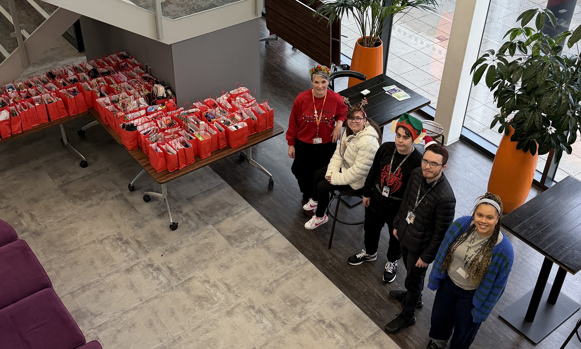 College students, staff and governors share Christmas cheer with YMCA residents | Northamptonshire Chamber of Commerce
